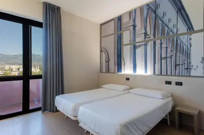 Letto o letti in una camera di B&B Hotel Firenze Nuovo Palazzo Di Giustizia