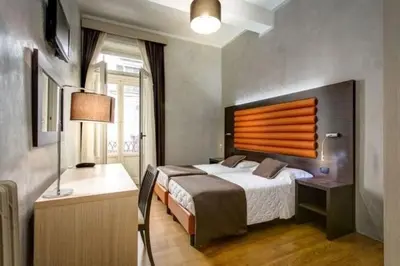 Letto o letti in una camera di The One Firenze