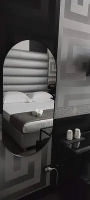 Letto o letti in una camera di The One Firenze