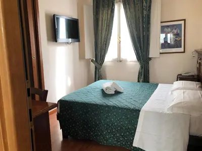 Letto o letti in una camera di Hotel Le Due Fontane