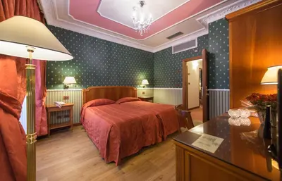Letto o letti in una camera di Strozzi Palace Hotel