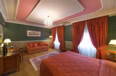 Letto o letti in una camera di Strozzi Palace Hotel