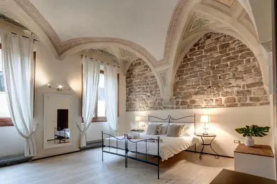 Letto o letti in una camera di Calzaiuoli Apartments by Mamo Florence