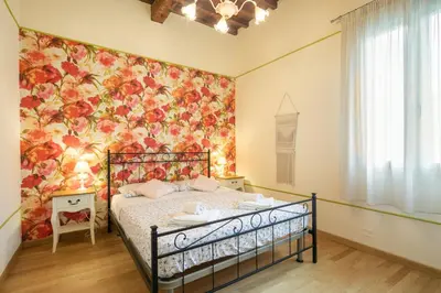 Letto o letti in una camera di Appartamenti degli Artisti by Mmega