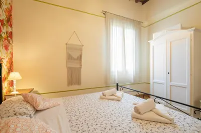Letto o letti in una camera di Appartamenti degli Artisti by Mmega