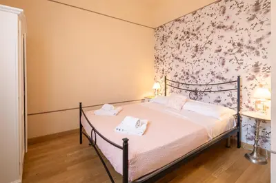 Letto o letti in una camera di Appartamenti degli Artisti by Mmega