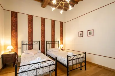 Letto o letti in una camera di Appartamenti degli Artisti by Mmega