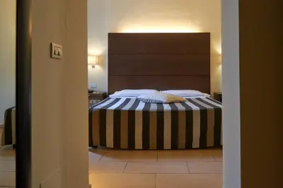 Letto o letti in una camera di Hotel Cosimo de' Medici