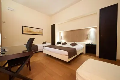 Letto o letti in una camera di Hotel Cosimo de' Medici
