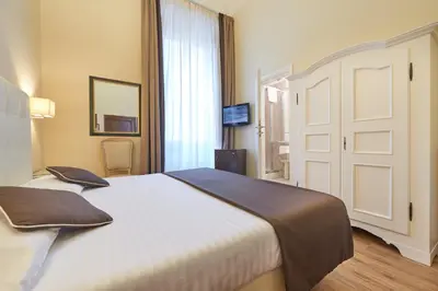 Letto o letti in una camera di Hotel Cosimo de' Medici