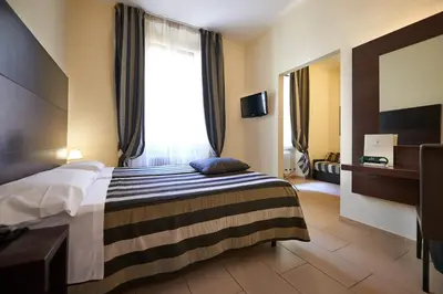 Letto o letti in una camera di Hotel Cosimo de' Medici