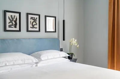 Letto o letti in una camera di Flom Boutique Hotel