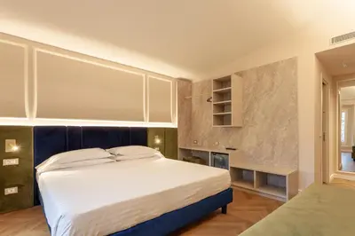 Letto o letti in una camera di Hotel La Fortezza