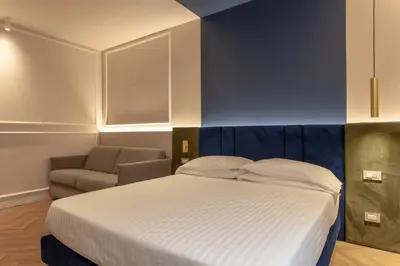 Letto o letti in una camera di Hotel La Fortezza