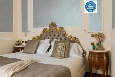 Letto o letti in una camera di Hotel Bernini Palace