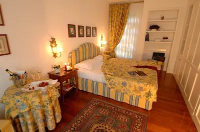 Letto o letti in una camera di Marignolle Relais & Charme - Residenza d'Epoca