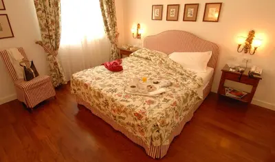 Letto o letti in una camera di Marignolle Relais & Charme - Residenza d'Epoca