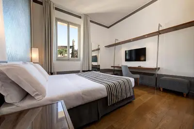 Letto o letti in una camera di Hotel Orto de' Medici