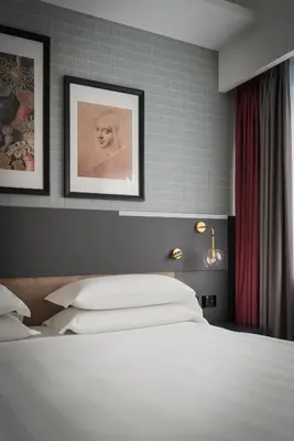 Letto o letti in una camera di iQ Hotel Firenze