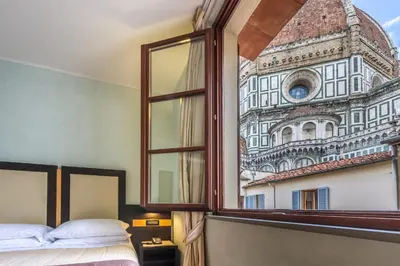 Letto o letti in una camera di Hotel Duomo Firenze