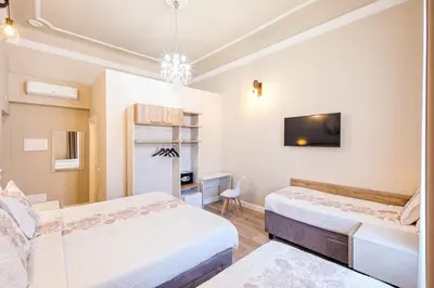 Letto o letti in una camera di Hotel Bijou Roof Terrace