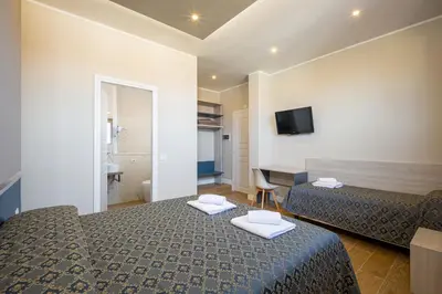 Letto o letti in una camera di Hotel Bijou Roof Terrace