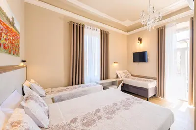 Letto o letti in una camera di Hotel Bijou Roof Terrace