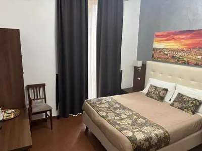 Letto o letti in una camera di Hotel Ester
