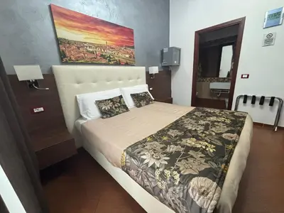 Letto o letti in una camera di Hotel Ester
