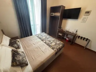 Letto o letti in una camera di Hotel Ester