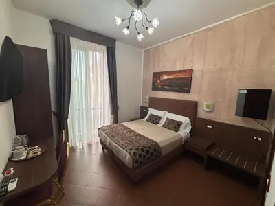Letto o letti in una camera di Hotel Ester