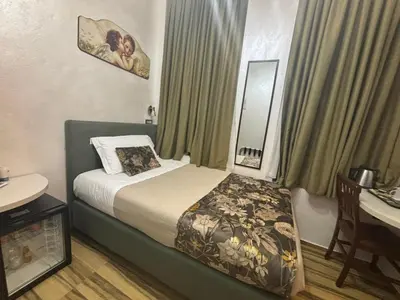 Letto o letti in una camera di Hotel Ester
