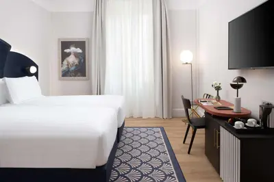 Letto o letti in una camera di Anglo American Hotel Florence, Curio Collection By Hilton