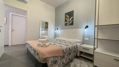 Letto o letti in una camera di GUEST HOUSE KINGA CAVOUR