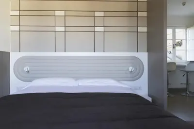 Letto o letti in una camera di Palazzo dei Ciompi Suites