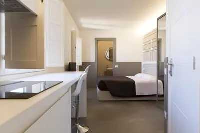 Letto o letti in una camera di Palazzo dei Ciompi Suites