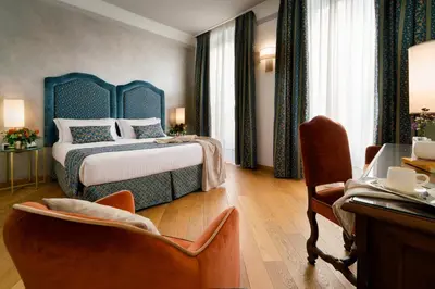 Letto o letti in una camera di Rivoli Boutique Hotel