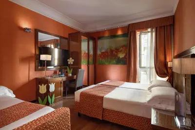 Letto o letti in una camera di Grand Hotel Adriatico