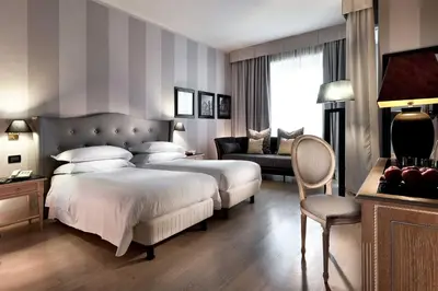 Letto o letti in una camera di c-hotels Ambasciatori