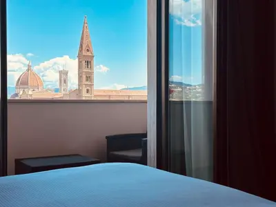 Letto o letti in una camera di c-hotels Ambasciatori