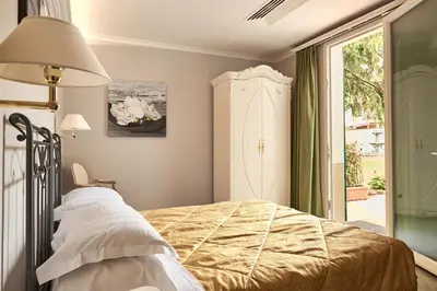 Letto o letti in una camera di Villa Royal