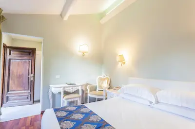 Letto o letti in una camera di Villa Royal