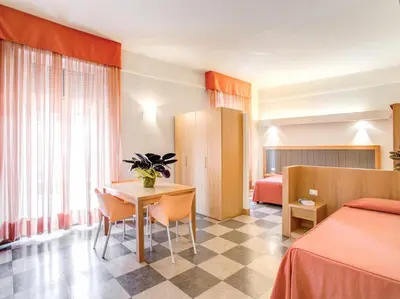 Letto o letti in una camera di Hotel Delle Nazioni