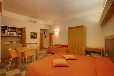 Letto o letti in una camera di Hotel Delle Nazioni