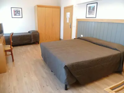Letto o letti in una camera di Hotel Delle Nazioni