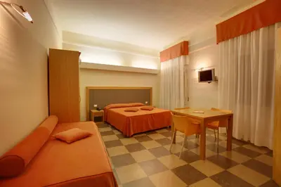 Letto o letti in una camera di Hotel Delle Nazioni