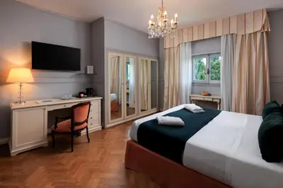 Letto o letti in una camera di Hotel Villa Carlotta