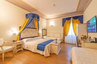 Letto o letti in una camera di Hotel Porta Faenza