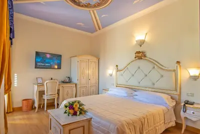 Letto o letti in una camera di Hotel Porta Faenza