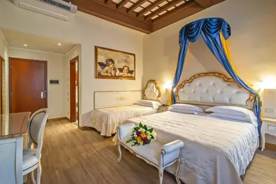 Letto o letti in una camera di Hotel Porta Faenza